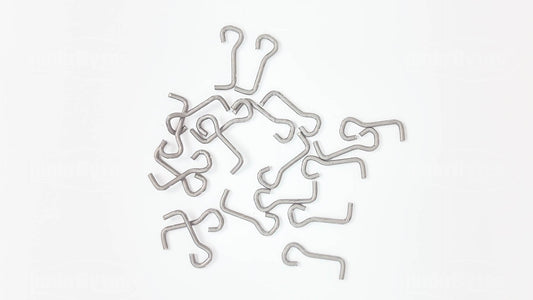Loose pile of WEY-525 stainless steel underspin wire forms